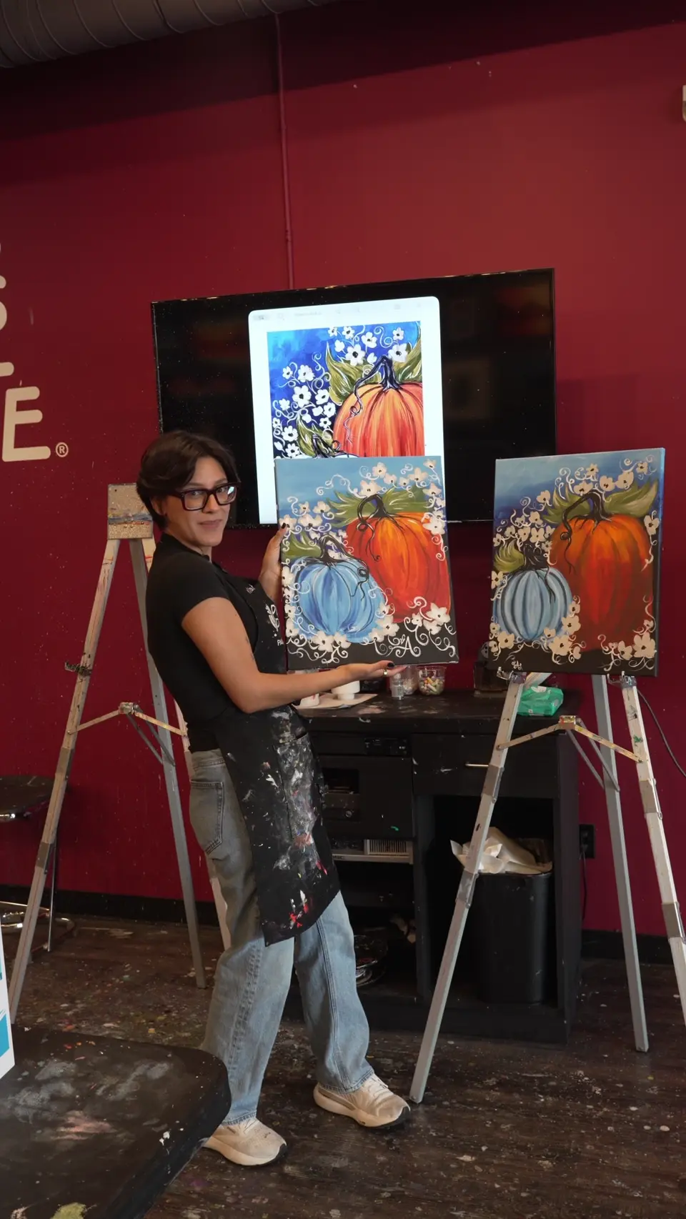 Andrea painting in the studio